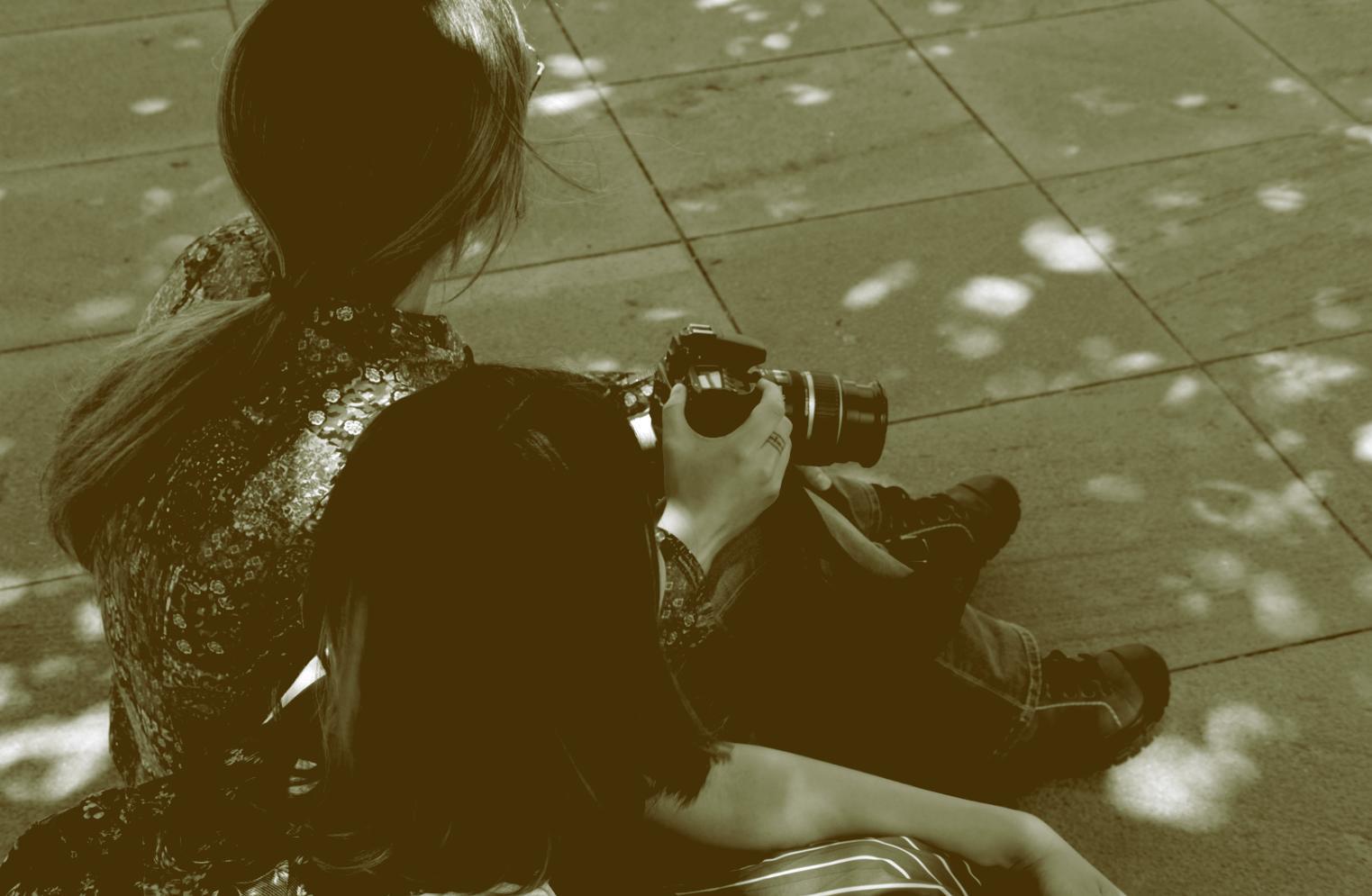 Photographer analyzing composition during outdoor session